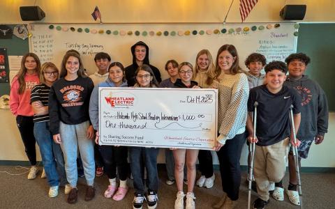 Holcomb High School Reading Interventions instructor, Rachel Davis (second from right) and students receive a $1,000 Wheatland Electric Sharing Success grant to help purchase new materials for the reading intervention program.