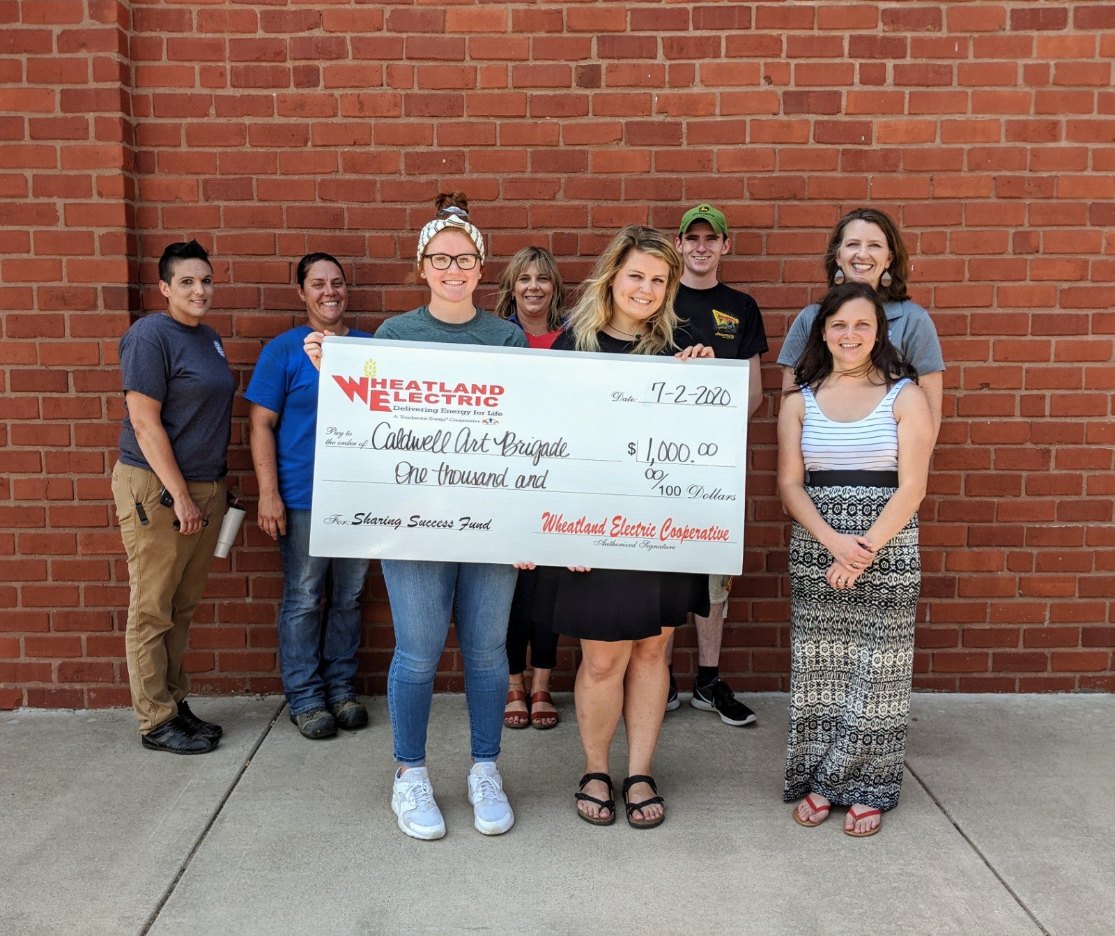 Caldwell community members gathered to accept their $1,000 Sharing Success Grant from Wheatland Electric on July 2, 2020. 